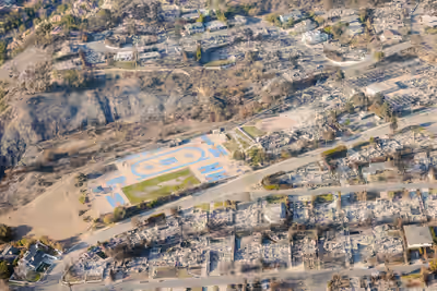 Aerial image of fire-damaged structures on Marquez Avenue in Pacific Palisades after 2025 wildfire