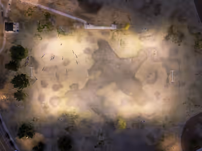 Overhead aerial view of soccer practice on lit field at dusk in Tempe, Arizona