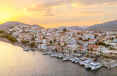 Aerial view of boats docked at Ermioni waterfront after sunset in Greece