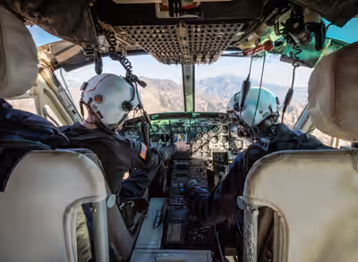 Cockpit of Bell 412 firefighting helicopter flying over Los Angeles during 2025 wildfires