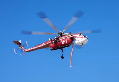 Sikorsky CH-54B Skycrane helicopter in flight with rotors turning during 2025 wildfire
