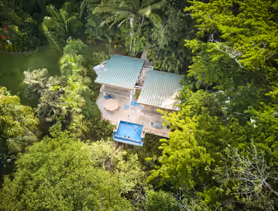 Aerial view of Chaa Creek jungle villa and infinity pool in Belize