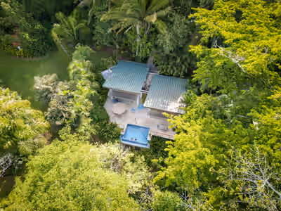 Aerial view of Chaa Creek jungle villa and infinity pool in Belize