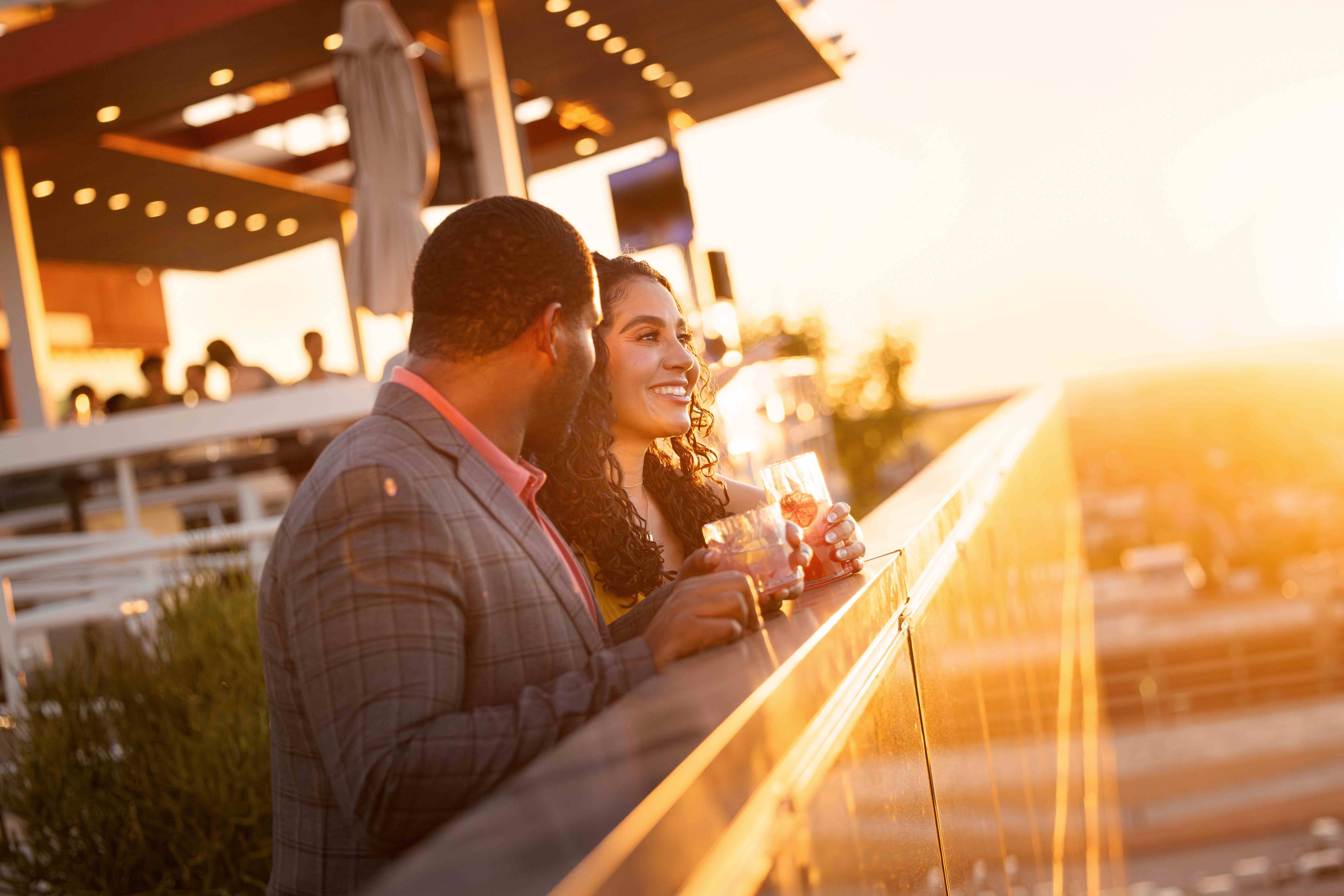 Couple enjoying sunset views at Skysill Rooftop Lounge in Tempe, Arizona