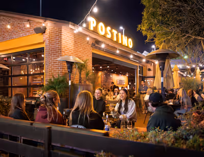 Group of friends enjoying wine and bruschetta boards at Postino Annex in Tempe