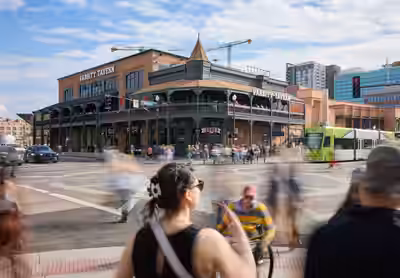Crowd crossing Fifth Street and Mill Avenue at the Laird and Dines Building Tempe